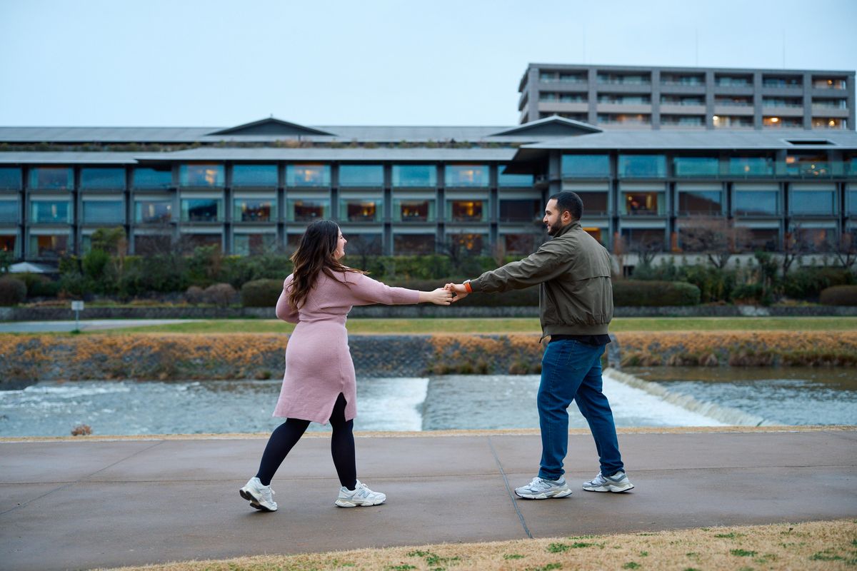 Hand in hand, dancing beside the Kamo River