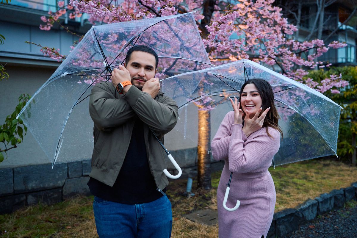 Playful moment under cherry blossoms